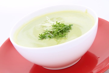 Pea and mozzarella soup decorated with cress