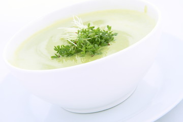 Pea and mozzarella soup decorated with cress