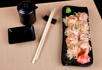 Table place setting with sushi roll