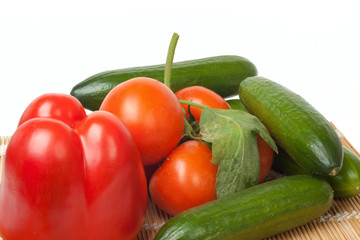 Ripe vegetables on a straw mat