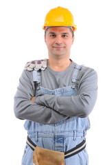 Construction worker with crossed hands over white background