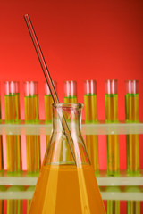 Laboratory glassware on red background