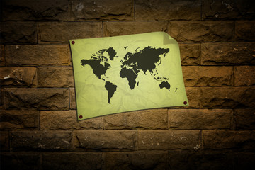 crumpled vintage world map on Brick walls background