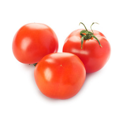 Three tomatoes with a green branch isolated on a white backgroun