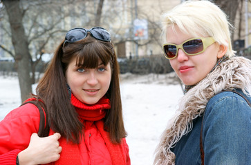 Two young beautiful women in the street