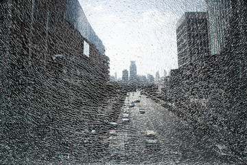 City landscape through shattered glass