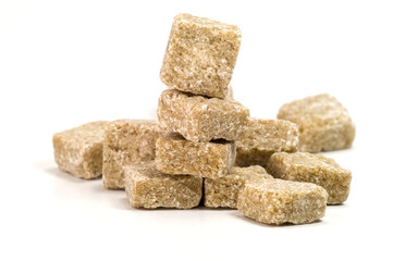 Pile of brown sugar on white background