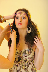 Fototapeta premium Young beautiful fashion woman with creative eye make-up having h