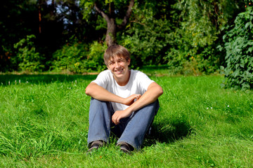 Naklejka na ściany i meble smiling teenager in the summer park