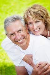 Mature couple smiling and embracing