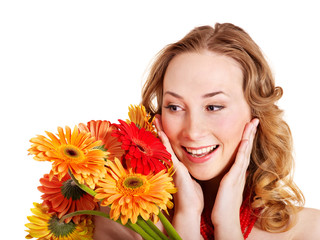 Happy young woman holding flowers.