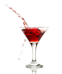 red martini cocktail splashing