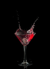 red martini cocktail splashing