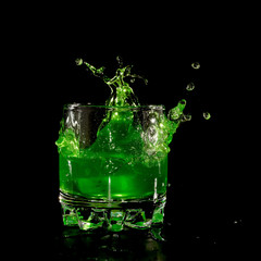 Orange in green water splash