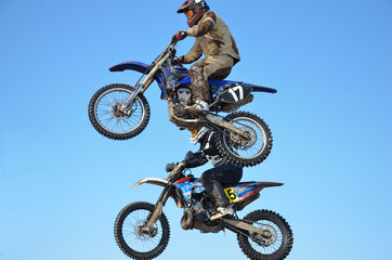motocross rider jump, blue sky