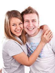 Young couple is smiling and hugging