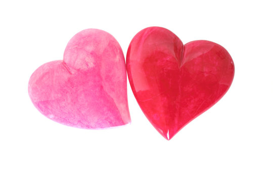 Two pink and red hearts isolated on white background