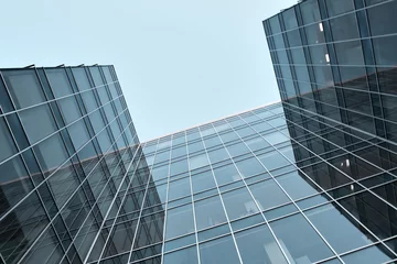 Foto auf Acrylglas prospective view to new modern building skyscrapers © Vladitto