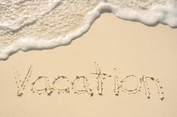 Vacation Written in Sand on Beach