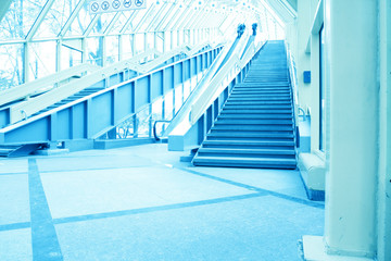 blue modern escalator in business center