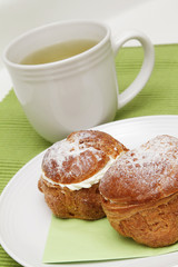 Two profiteroles and tea