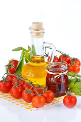 Fresh and dried tomatoes, olive oil and basil.