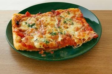pizza with tomatoes and mozarella cheese