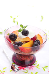 healthy breakfast -muesli with fresh berries, fruit and yoghurt