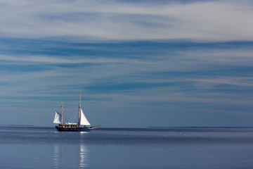 Lonely sailboat at sea