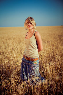 Image of young woman on wheat field