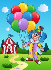 Obraz na płótnie Canvas Clown girl with balloons near tent