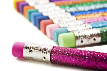 Colorful pencils covered in glitter