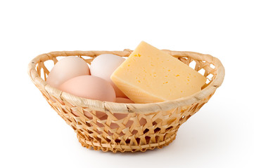 Eggs and cheese lay in a woven basket