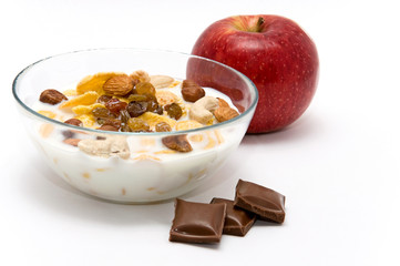muesli with chocolate and apple isolated on white background