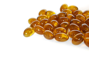 brown fish oil gel capsule pills closeup