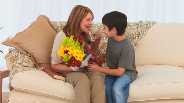 Child bringing a bunch of flowers