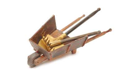 miniature model of the wheelbarrow with tools for work in garden