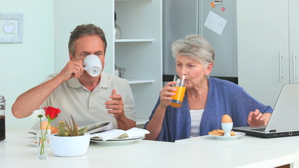 Cute mature couple taking a breakfast - Powered by Adobe