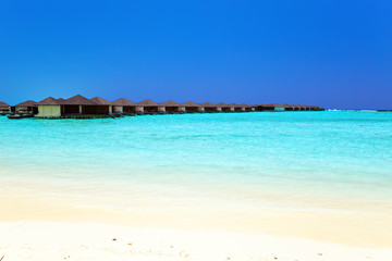Maldives.Villa on piles on water .