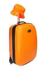 Orange suitcase for travel and a hat