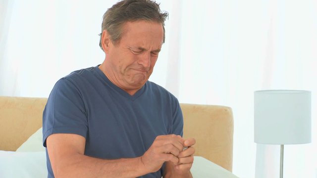 A sick man taking his pills