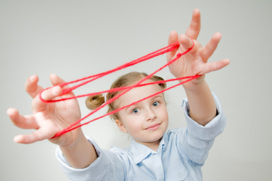 Creative Mind - Girl Playing Cats Cradle Game