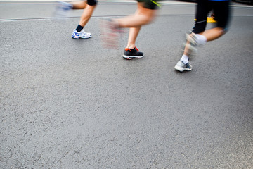 People running in city marathon