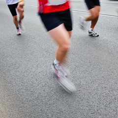 People running in city marathon