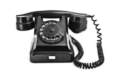An old black vintage rotary style telephone - 30981469