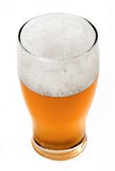 mug with lager beer and froth over white background