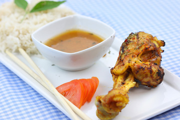 Chicken drum stick with curry sauce and rice