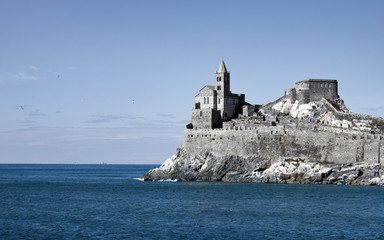 Fototapeta na wymiar grey citadel blue sea