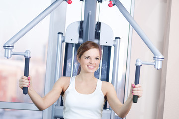 Fototapeta premium Young woman at the gym