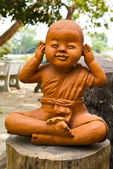 Fototapeta na wymiar statue of a cute little monk